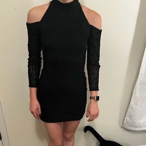 Black dress with subtle sequin pattern.